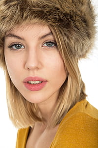woman wearing brown fur hat taking selfie thumbnail