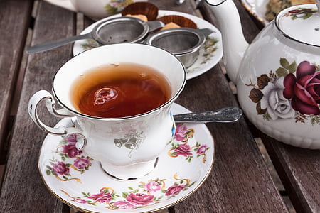 white teacup with tea and spoon thumbnail