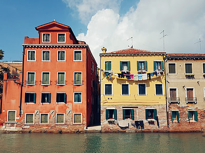 three concrete houses near river thumbnail