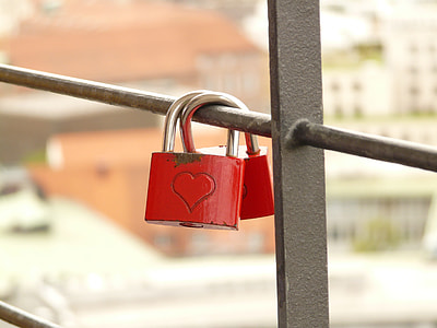 two red padlocks hanged on the handrails thumbnail