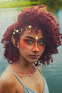 woman standing near body of water thumbnail