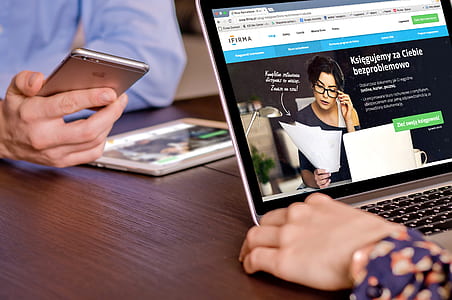 person's holding turned on laptop thumbnail