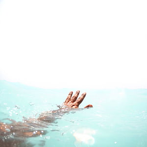 person showing hand on water thumbnail