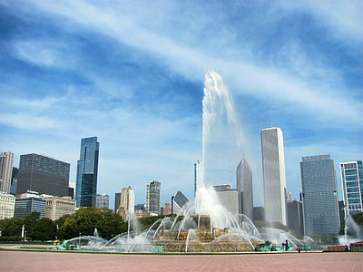 water fountain near tall buildings at daytime thumbnail