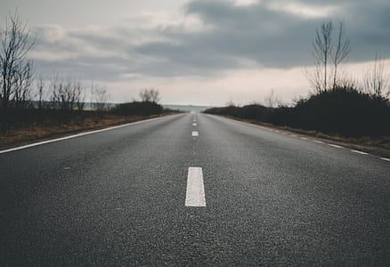 empty road under gray sky thumbnail
