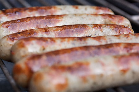 sausages grilling on grill thumbnail