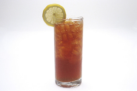 tea in a glass with ice and lemon against white background thumbnail