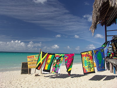 assorted-color banner hangs near body of wter thumbnail