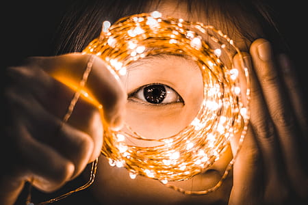 person holding string light thumbnail
