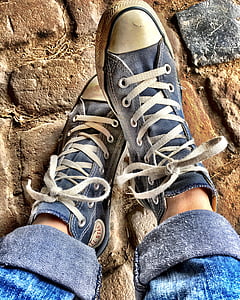 person wearing gray sneakers thumbnail