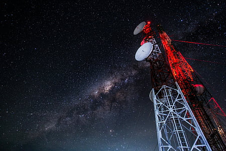 two white satellite dishes photo during nighttime thumbnail