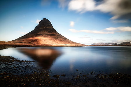 brown volcano near lake thumbnail