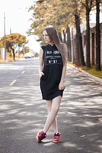 woman standing while looking sideways thumbnail