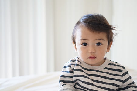 toddler poses wearing black and gray striped crew-neck shirt thumbnail