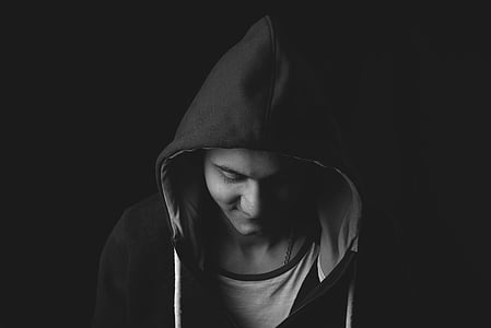 grayscale photo of man in hoodie thumbnail