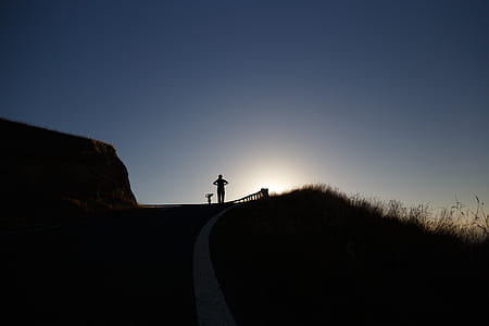 woman's silhouette standing above pathway thumbnail