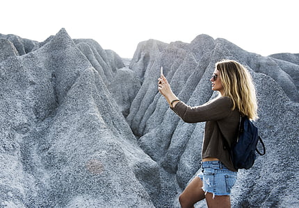 woman standing near mountain raneg thumbnail