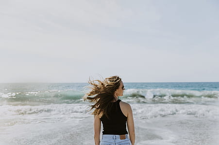 woman wearing black tank top during daytime thumbnail