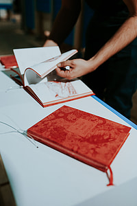Red book on a white table thumbnail