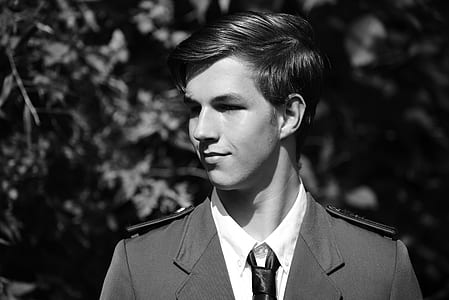 grayscale portrait photo of man in uniform thumbnail