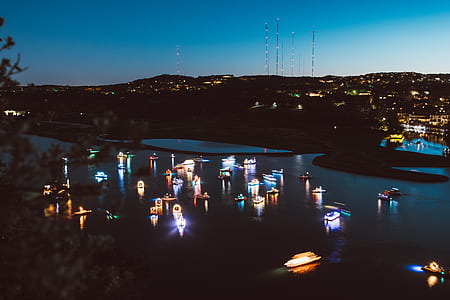 yacht on body of water during nighttime thumbnail