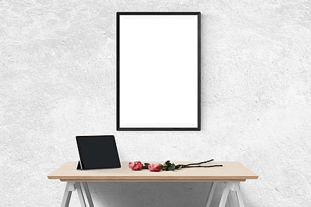rectangular mirror hanging on white wall thumbnail