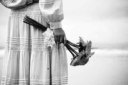 person holding flowers thumbnail