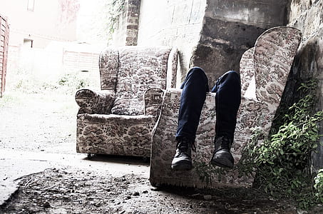 person lying on a wing chair thumbnail