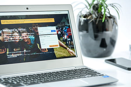 silver laptop computer turned on thumbnail