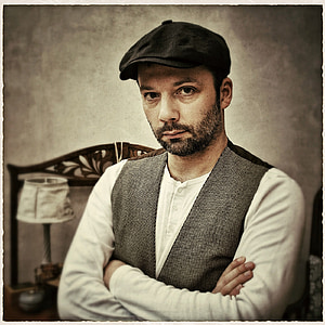 man wearing black hat patinign thumbnail