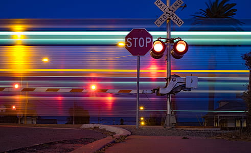 Stop and Railroad Crossing signs time lapse photo thumbnail
