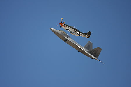 two gray fighter planes in flight thumbnail