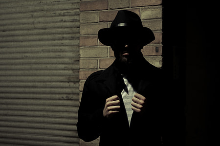 man standing in front of wall thumbnail