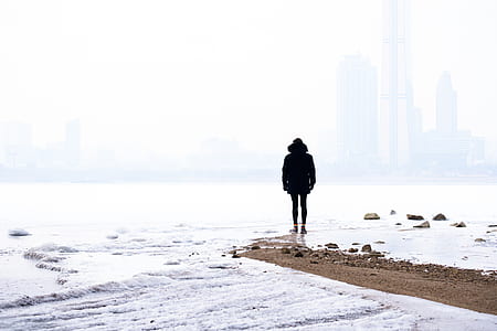 man standing on seashore thumbnail