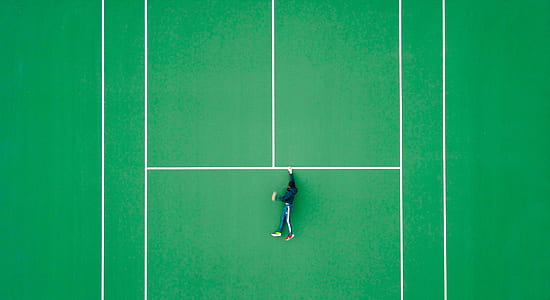 person in black jacket lying on field during daytime thumbnail