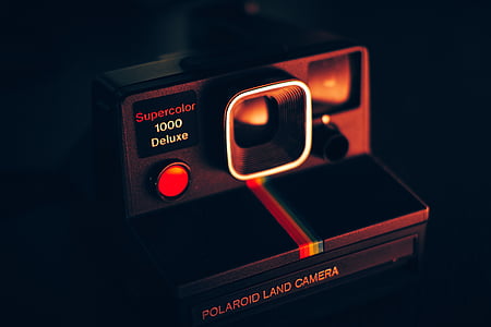 black and maroon Polaroid instant camera thumbnail