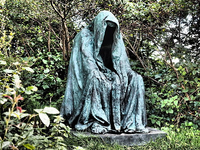 blue statue surrounded by grass thumbnail