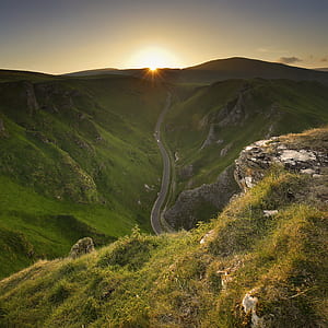 aerial view photography of mountain pass during sunrise thumbnail