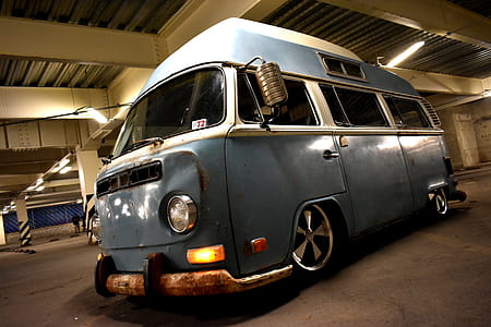 Classic Blue and White Van Parked Inside Building thumbnail