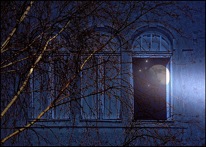 grey painted concrete house with one open window  during nighttime thumbnail