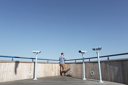 man standing outdoors facing backwards thumbnail