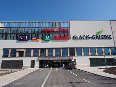 Glasic-Galerie building with gray car in front during daytime thumbnail