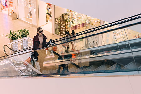 woman standing on escalator thumbnail