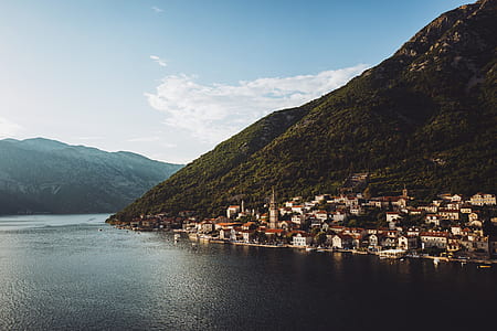 aerial photography of building and mountain during daytime thumbnail