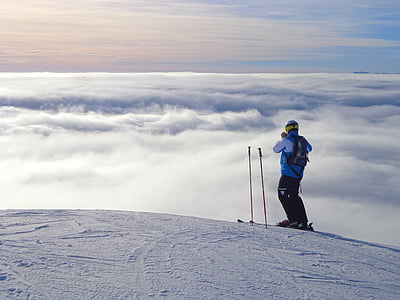 person standing on hills during daytime thumbnail