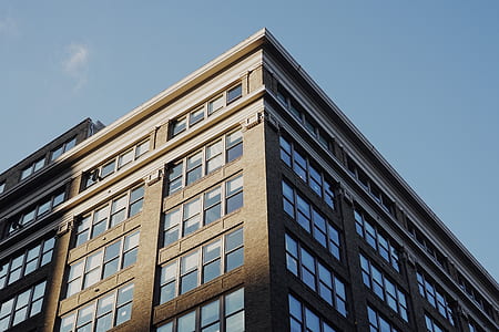 brown concrete building under clear blue sky at daytime thumbnail
