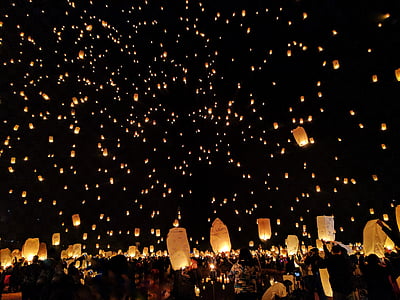 flying lanterns at nighttime thumbnail