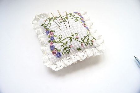 white and green crochet cushion thumbnail