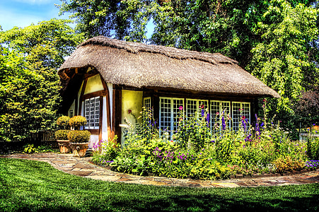 white and brown house surrounding plants and trees at daytime thumbnail