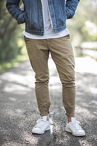 man in khaki pants and pair of white shoes thumbnail